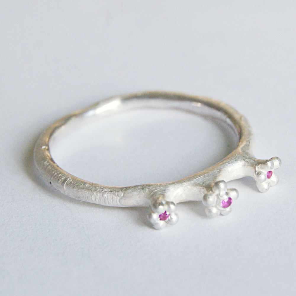 Cute Secret Garden Ring with three Tiny Flowers topped with Rubies
