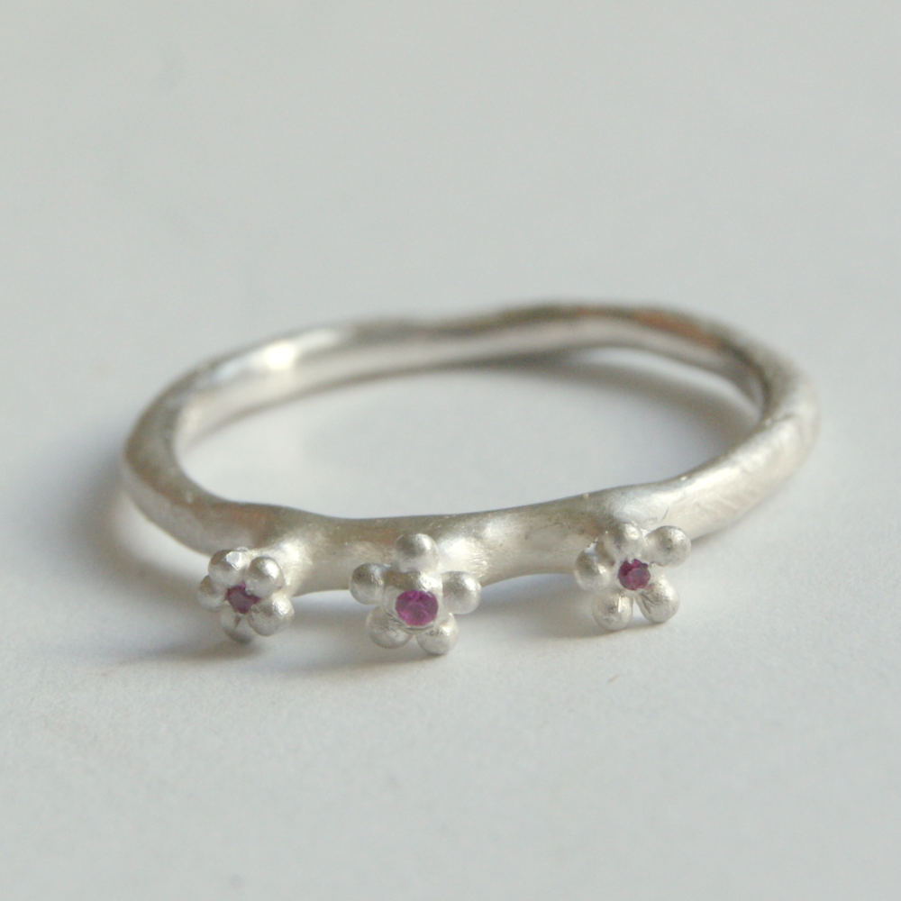 Cute Secret Garden Ring with three Tiny Flowers topped with Rubies